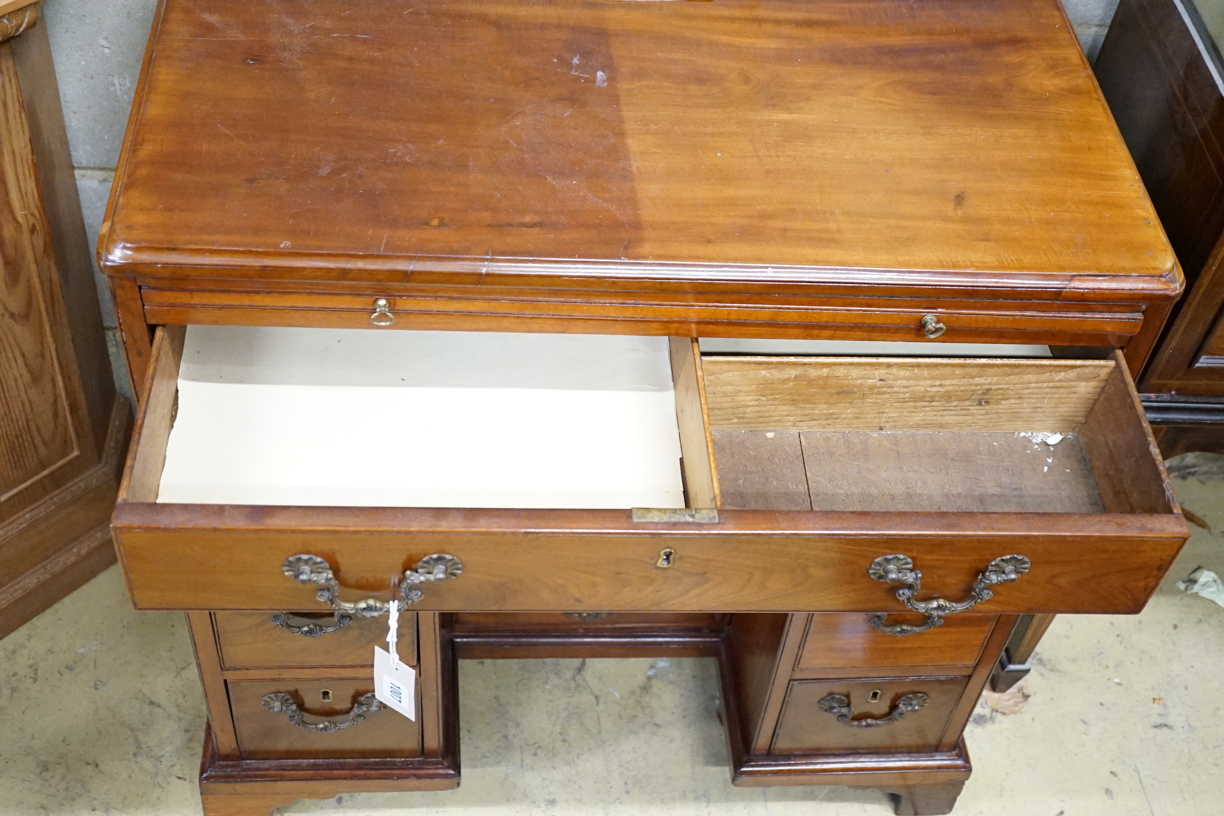 A George III mahogany kneehole desk with slide and four recess drawers, width 80cm, height 79cm